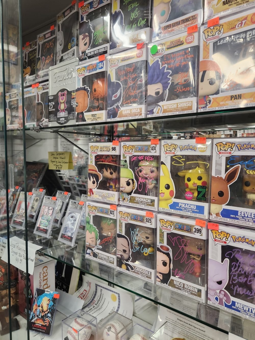 Case full of Funko Pops and vinyl figures