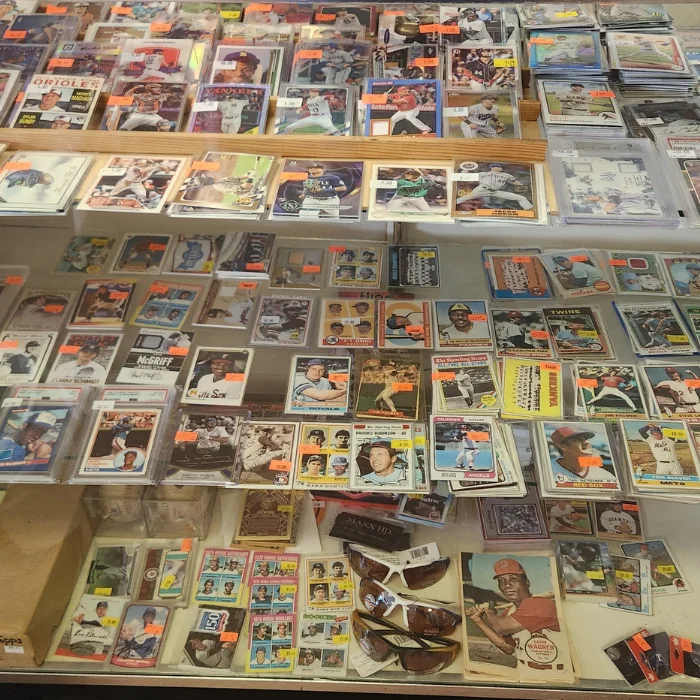 Sports card singles and graded slabs in the case